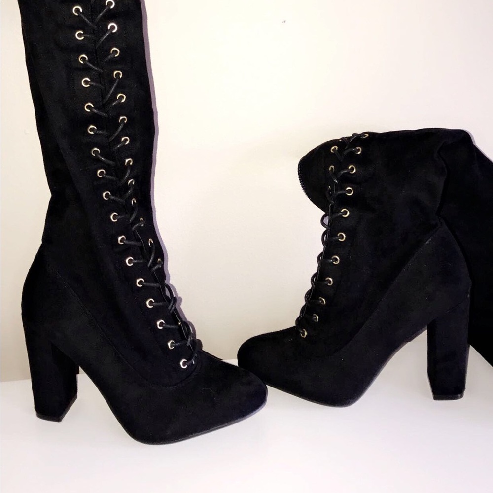 Thigh high heeled lace up boots